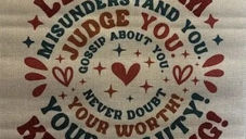 Inspirational text in bold colors on fabric reads: "Let them misunderstand you... Never doubt your worth... Keep shining!" Surrounded by stars and hearts