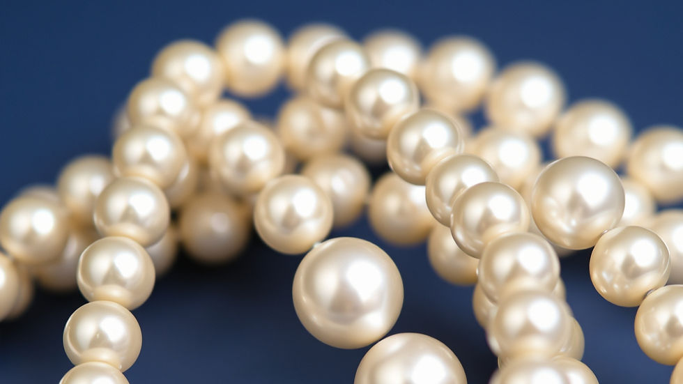 Pearl necklace strands on a dark blue background — a visual for 'judge not' and casting pearls before swine, Matthew 7:1.