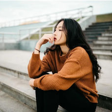 Woman sitting and thinking