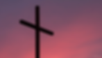 Silhouette of a cross against a vibrant pink and purple sunset sky, creating a serene and contemplative atmosphere.
