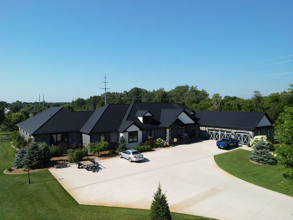 A home in Mishawaka IN with black concealed fastener metal roofing
