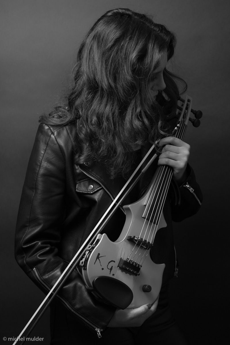 Katya Gabeli candid performance moment with violin and electronic setup