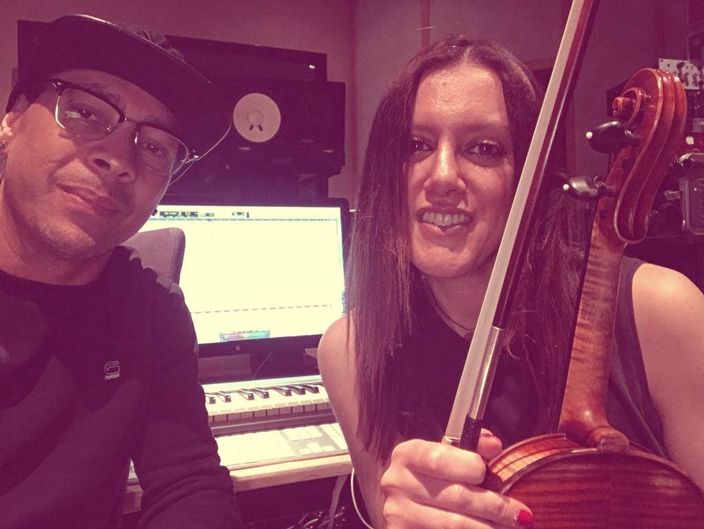 Close portrait of Katya Gabeli with electric violin