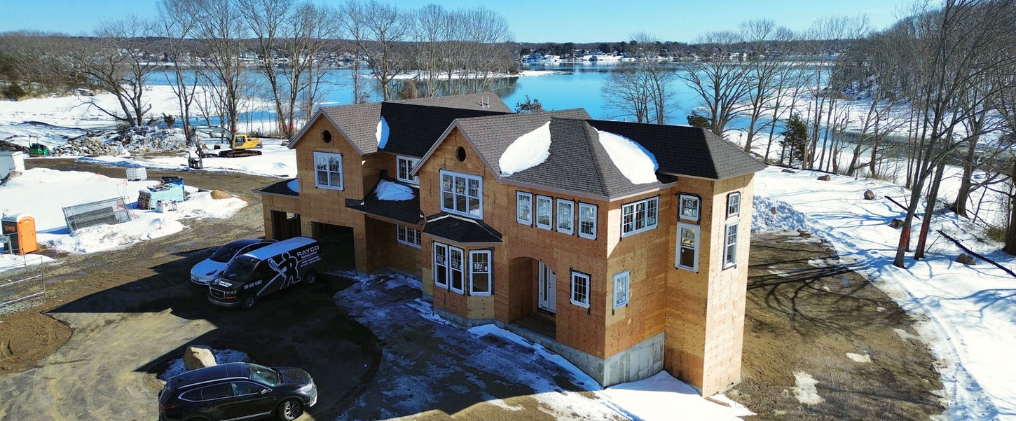 drone photo of coastal single family home