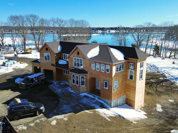 aerial view of new water front new construction home 