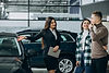 young-couple-choosing-car-car-show-room