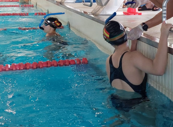 Close-up view of a swimmer measuring blood lactate levels