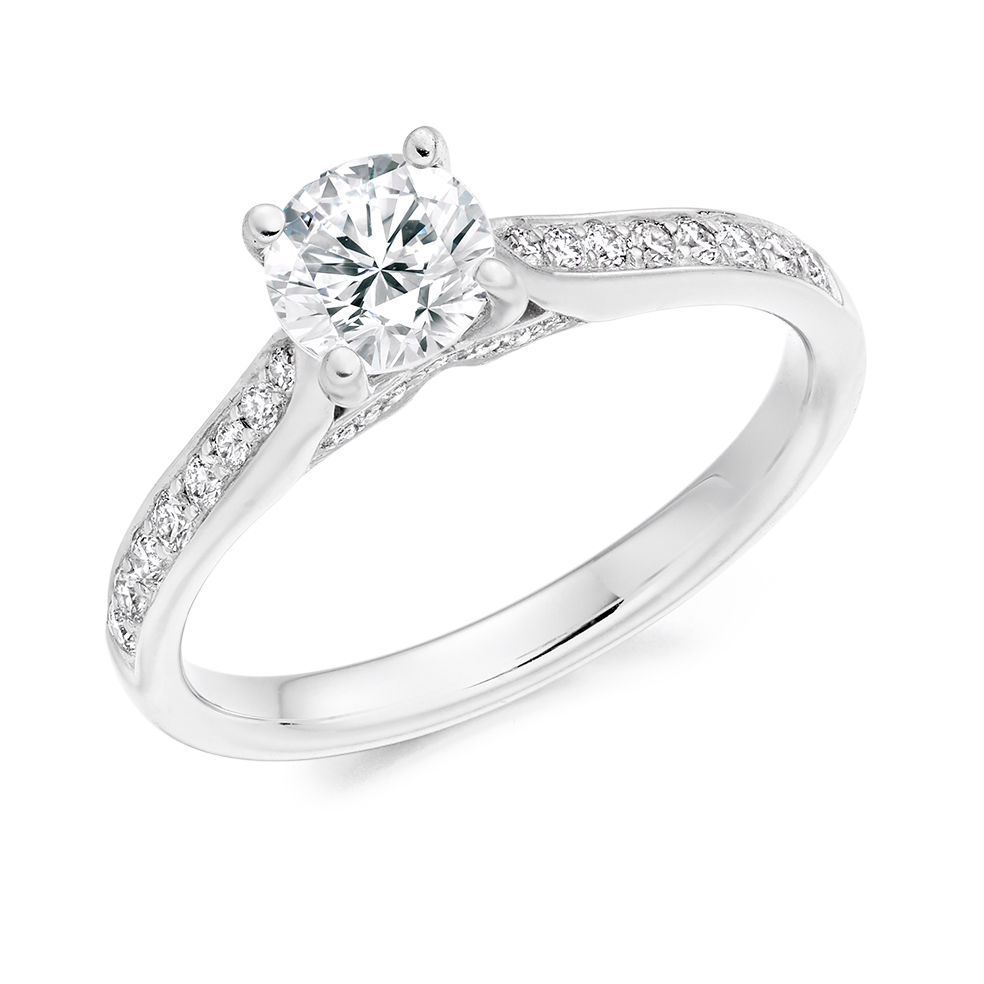 Round brilliant solitaire with diamond shoulders and mount