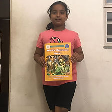 Children showing their favourite "Humans of Science" Booklet