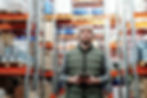 man-in-bubble-jacket-holding-tablet-comp