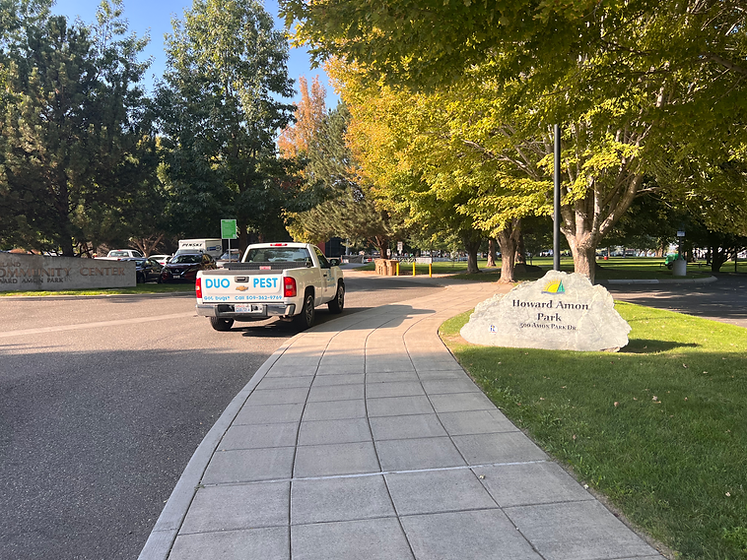 Duo Pest Control Truck Clearly in Font of Howard Amon Park Sign next to the Columbia River