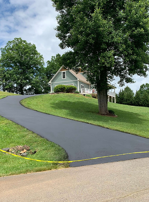 freshly paved uphill driveway