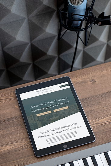 law office website mockup on a tablet sitting on a wooden desk, next to a podcast microphone
