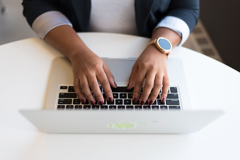 professional business woman typing on laptop