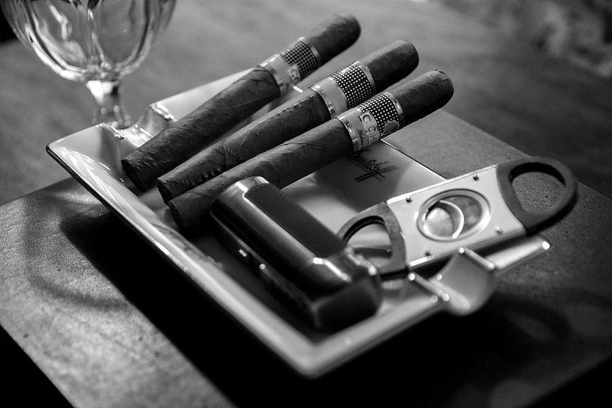 Cigars and accessories on a tray, ready to enjoy ABOUT the experience.
