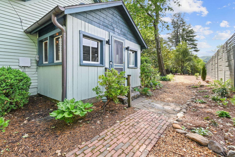 outside of mangolia cottage, brick sidewalk