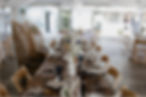 Wedding reception farmhouse style table with wooden chairs