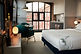 You really couldn't position a hotel much better for Manchester’s gay scene than LEVEN Manchester, sitting on the corner of Chorlton Street and Canal Street. I
nside a converted red-brick warehouse, the look is contemporary and stylish without feeling overly polished, with rooms starting at a generous 26 square metres and much larger apartment-style options available. Some include full kitchens and laundry facilities, making it particularly useful for longer stays.
There is also a relaxed cocktail bar, while Piccadilly Station is only around five minutes away. You get the Gay Village literally outside while still staying somewhere that feels like a proper design hotel.
GayMapper tip: A great alternative to Velvet if you want to stay directly in the Village but prefer a calmer, more contemporary apartment-hotel feel.