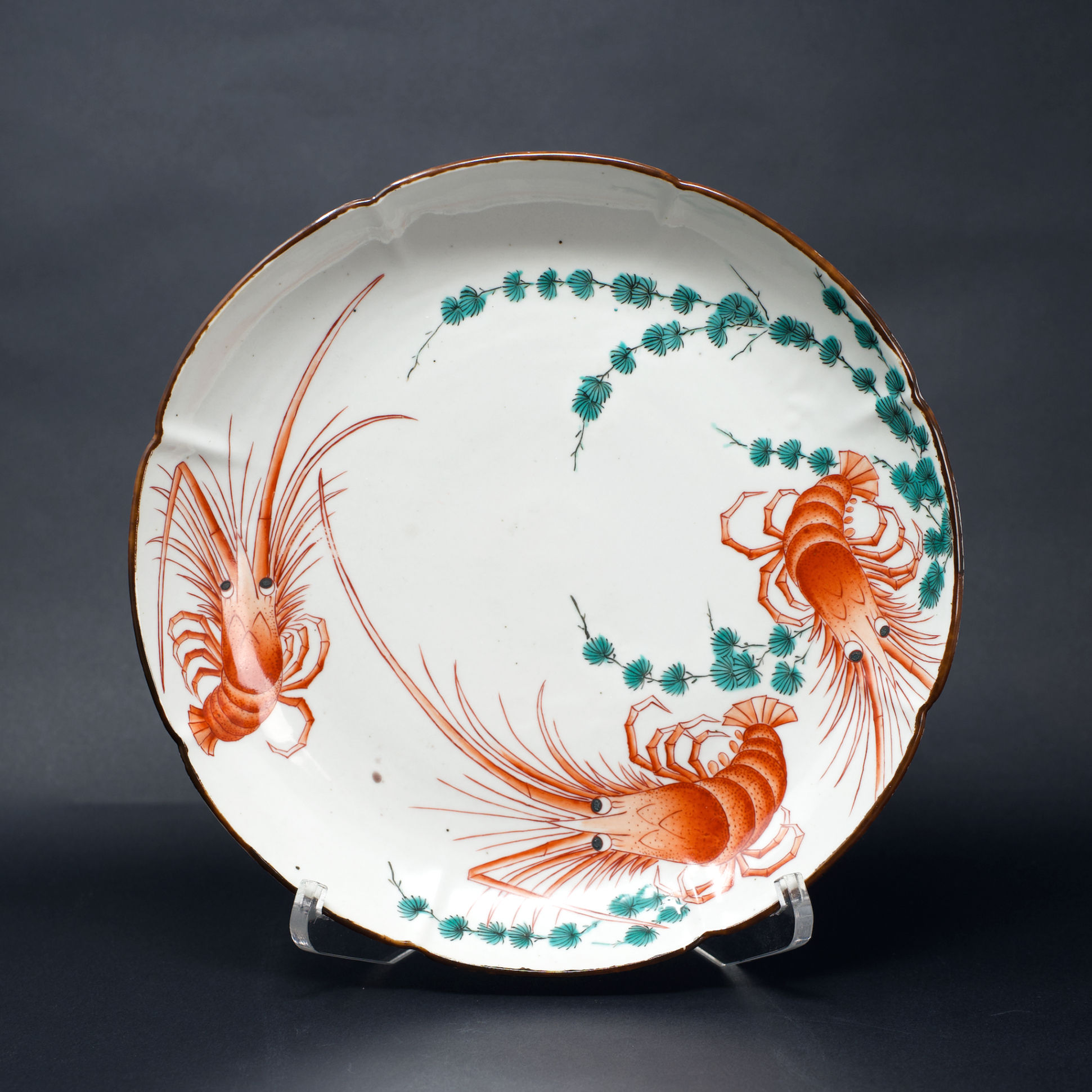 A striking Kakiemon dish enamelled with tiger prawns & seaweeds, Arita c1670-90