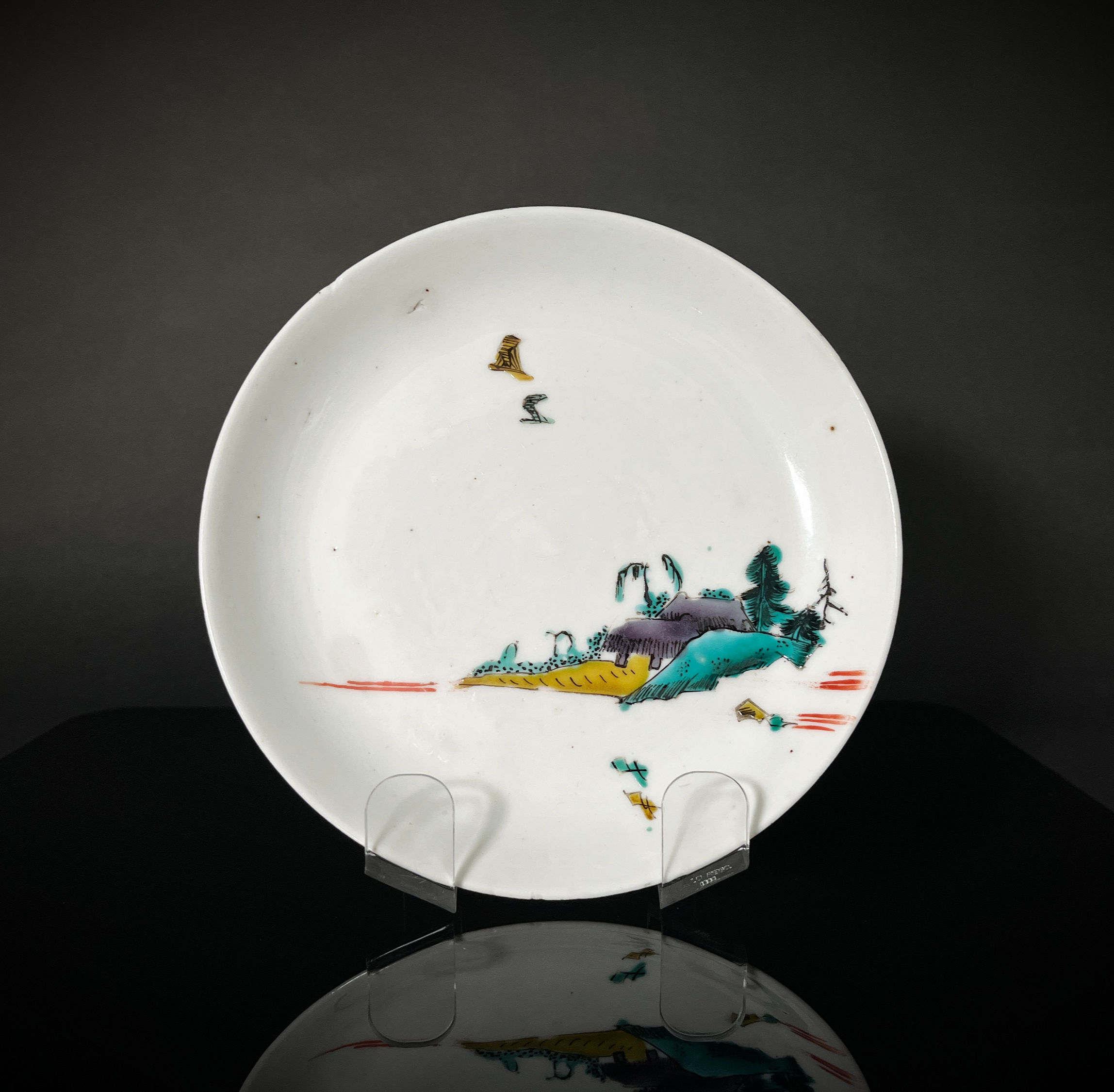 A mid 17thC early enamelled Ko-Kutani type Arita dish with seascape, c1650-60