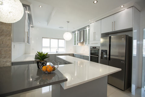 Folkstone and dunblane grey peen bullnose wrapped kitchen featuring two-toned grey and white quartz worktops.