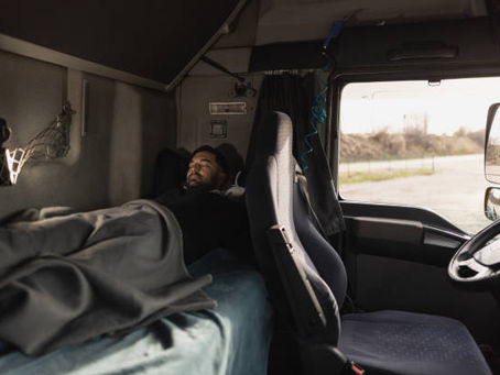 sleeper truck with owner operator sleeping in it