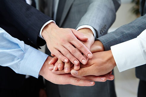 Hands stacked together for teamwork