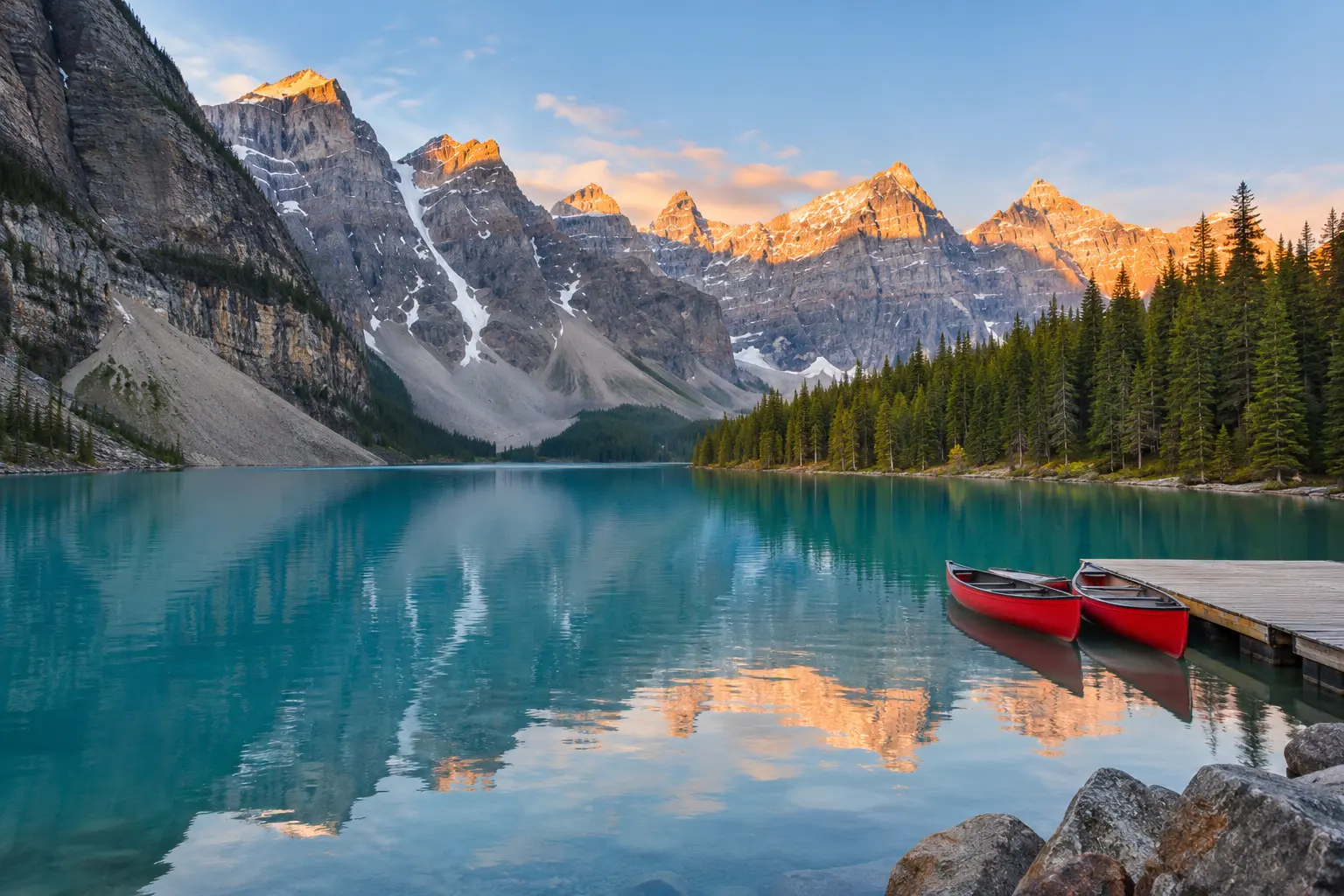 Turquoise alpine lake surrounded by peaks in the Canadian Rockies