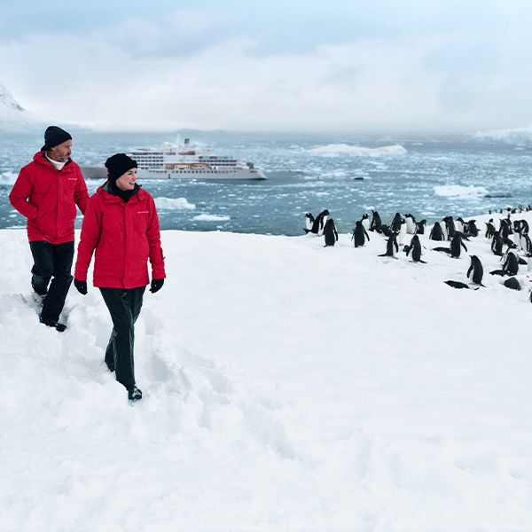 Cruise passengers on an excursion on an Alaskan glacier with Penguins.