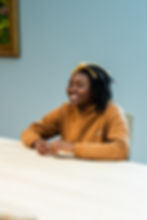 Child Sitting and Smiling