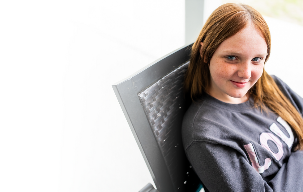 Image of Young Girl in Computer Chair