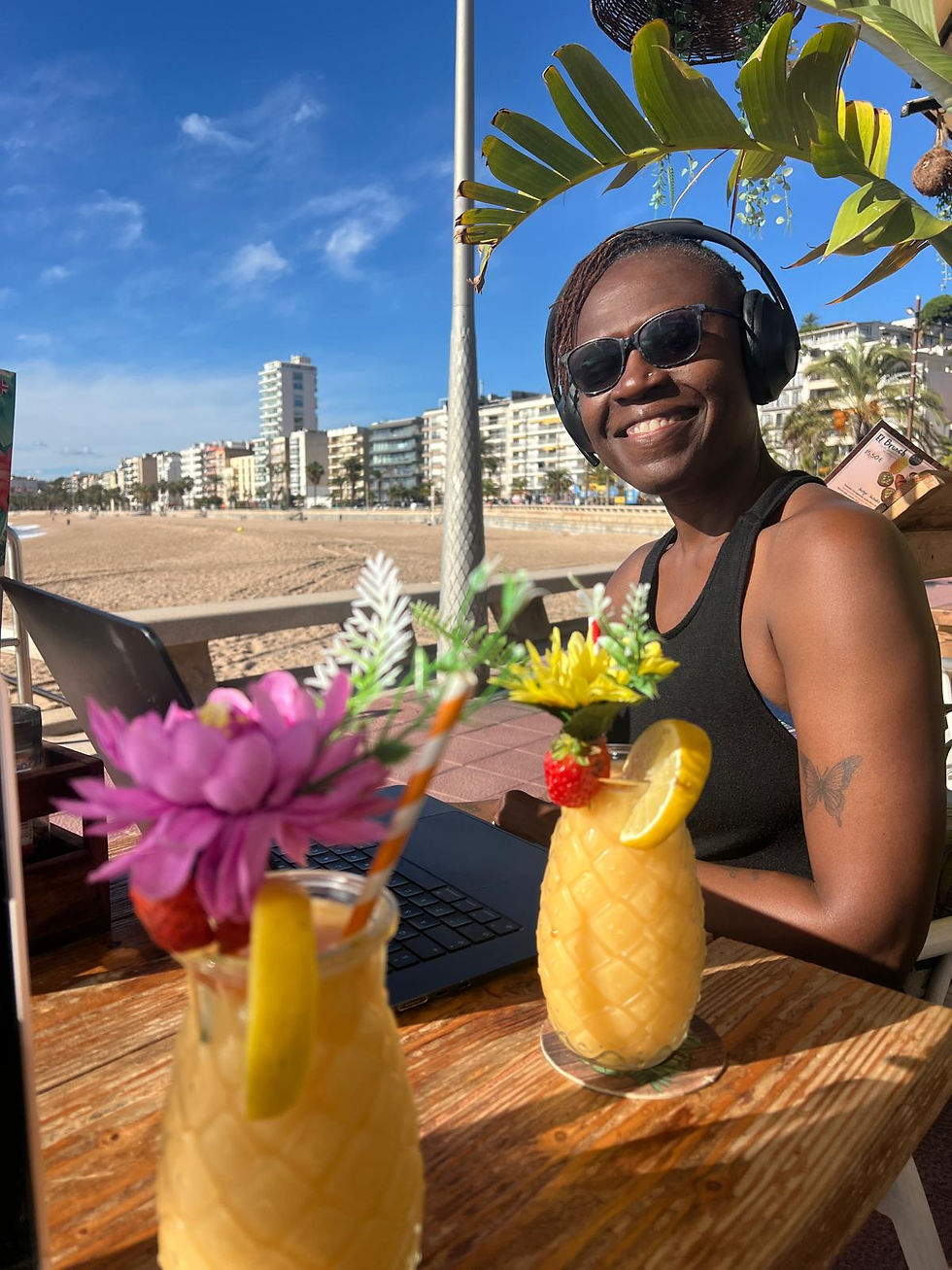 This is me at the seaside working and having a fruit smoothie