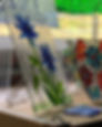 Close-up view of vibrant fused glass pieces