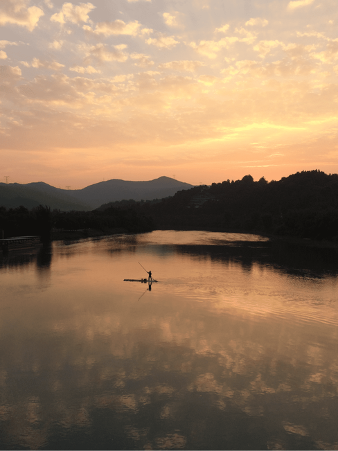a fisherman and sunset
