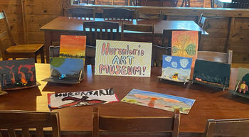 working as an art instructor at all boys camp