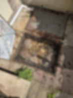 Full and overflowing manhole chamber due to blockage.