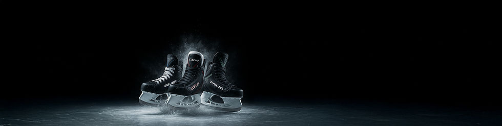 Three ice hockey skates silhouetted against a dark background, Skate Sharpening.