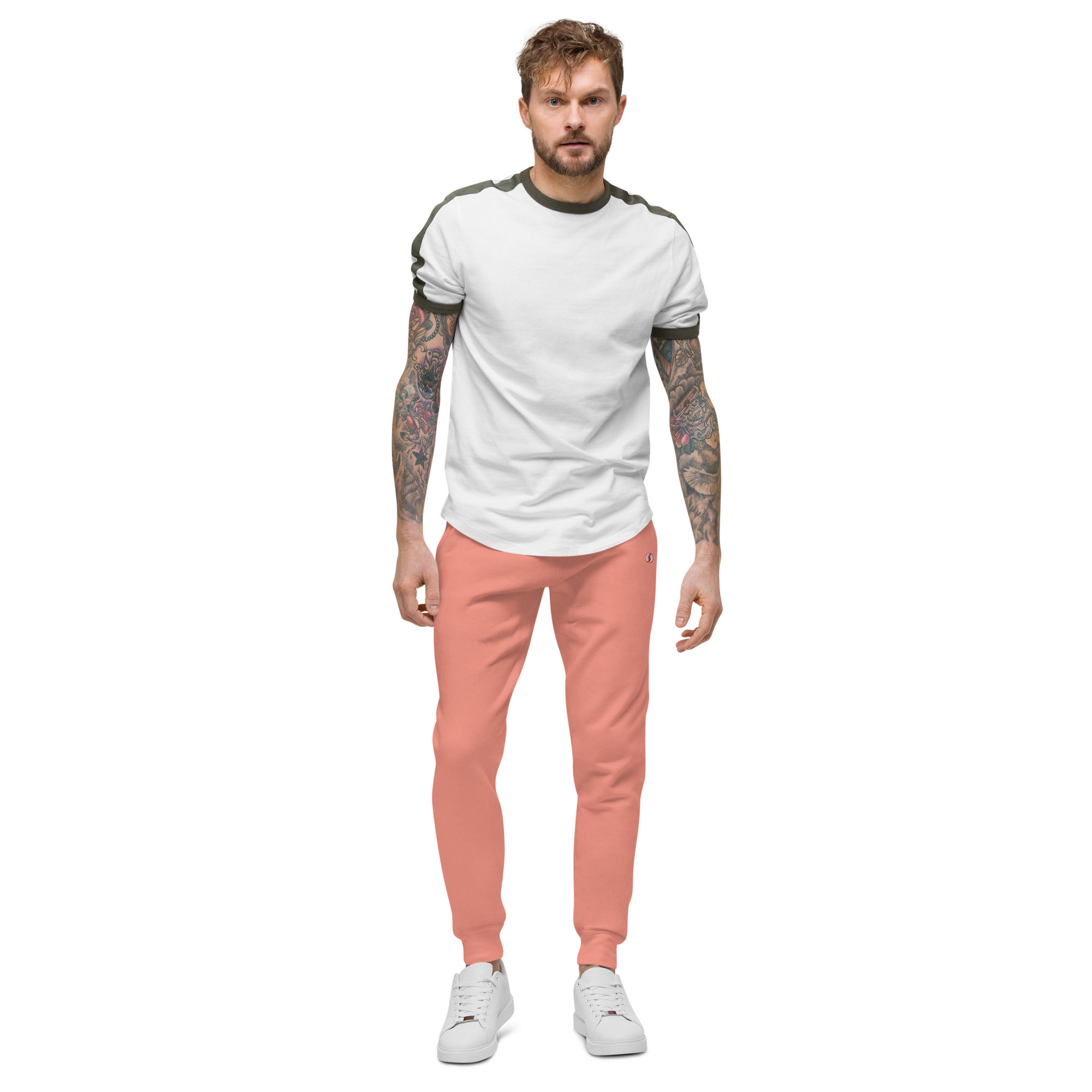 Man in coral joggers and white shirt