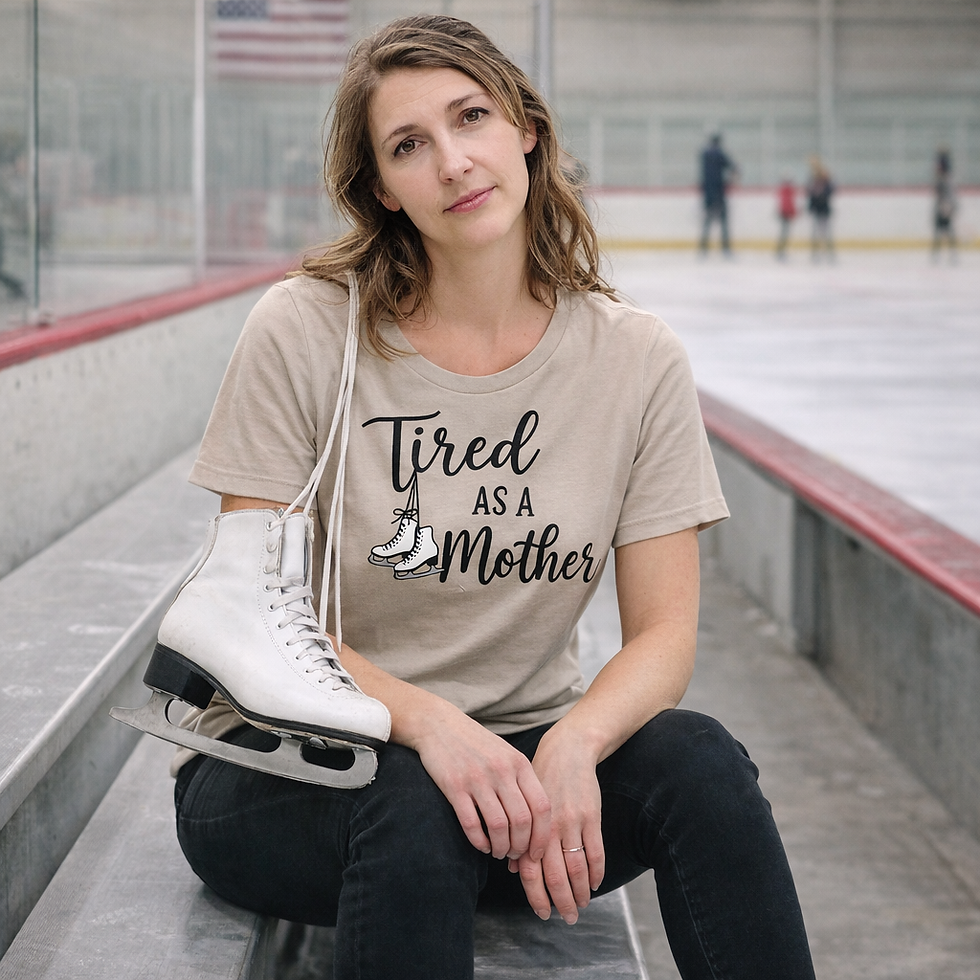 Woman wears "Tired as a Mother" Figure Skating T-Shirt at ice rink.