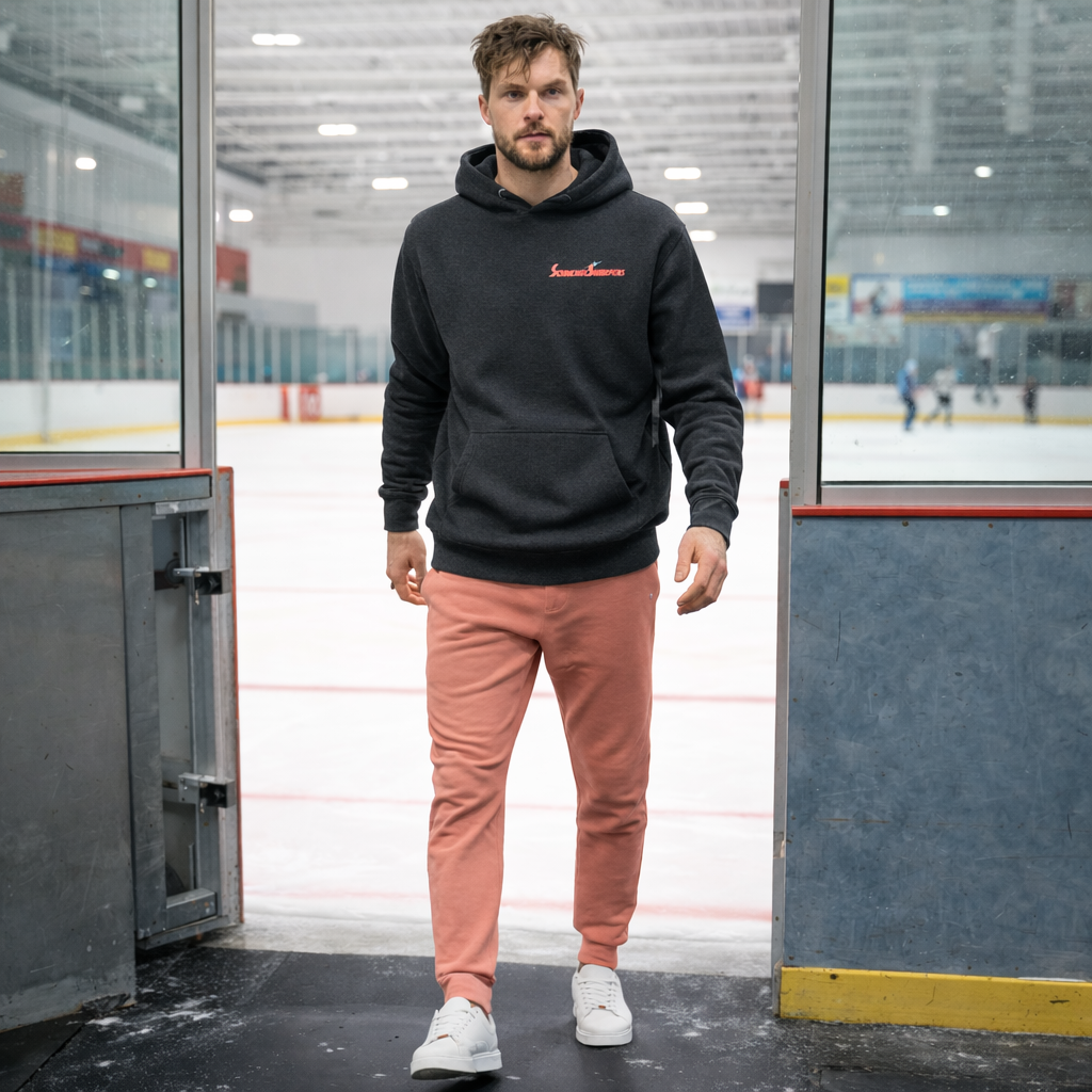 Man in Blade to the Bone black hoodie and sweatpants at hockey rink.