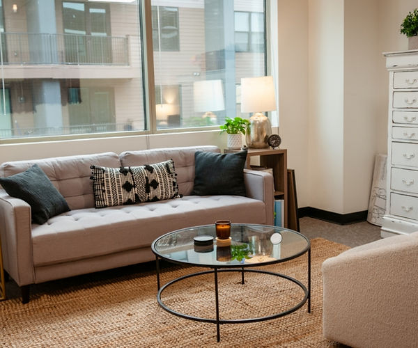 therapy office with windows and a gray couch