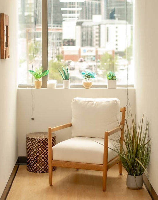 NCA interior hallway with a chair and window