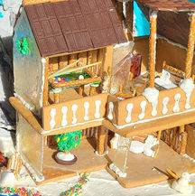 Gingerbread cabin with sugar glass floor to ceiling windows and a lake in front