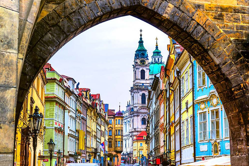 Close-up view of open choral music on a stone ledge overlooking Prague.