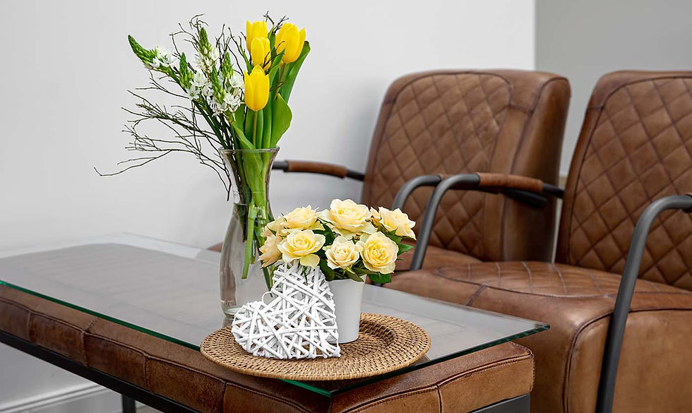 Yellow flowers and a white heart on a waiting room table