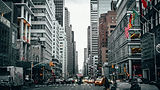 Busy New York City street with taxis and skyscrapers