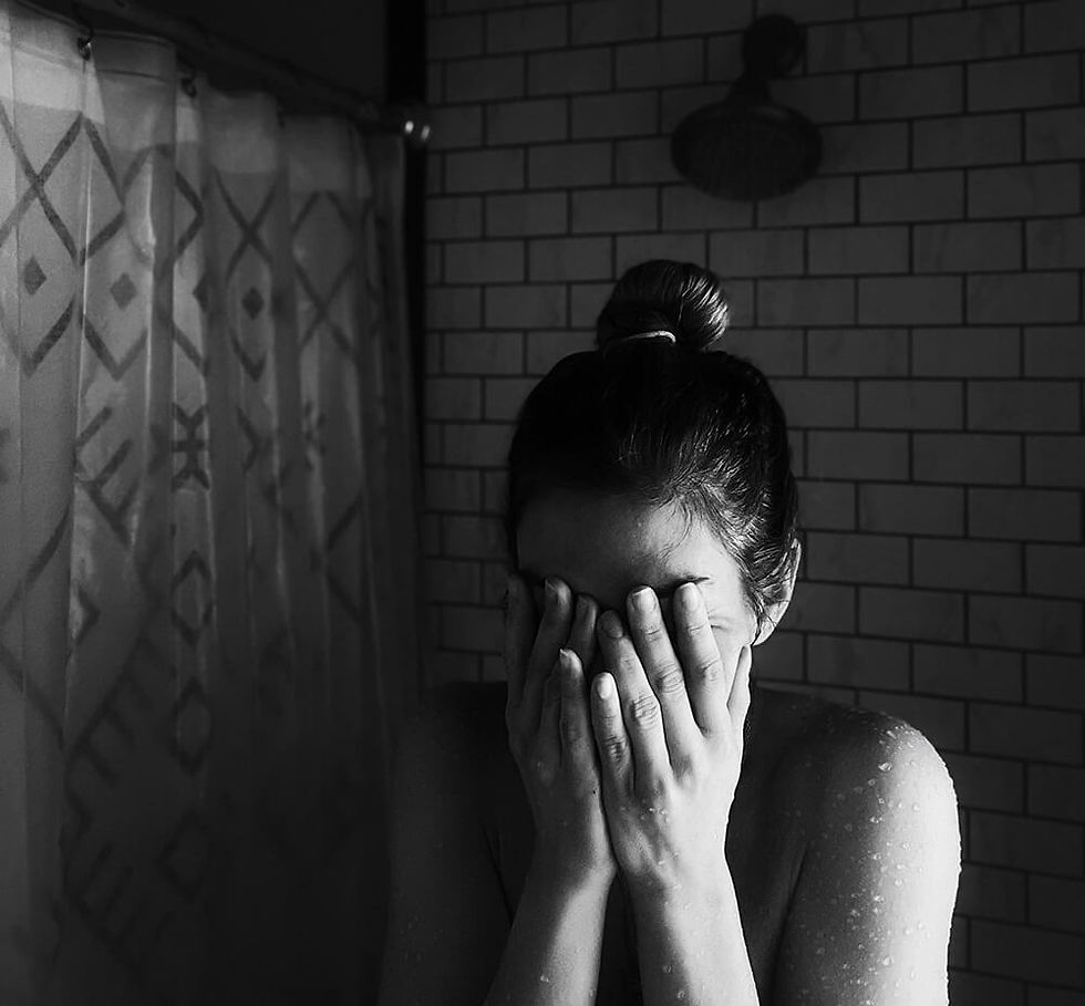 Woman reflecting during fertility grief and pregnancy loss while seeking EMDR therapy support in Vancouver