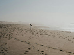 Person walking on a peaceful beach representing nervous system regulation and EMDR therapy in Vancouver