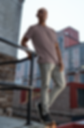 bella-canvas-t-shirt-mockup-of-a-man-posing-on-the-top-of-a-roof-m39812.png