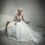 Thumbnail: Satin and tulle bridal gown with train